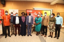 The Vice Chancellor, Prof. Barnabas Nawangwe (C) with the Principal CHUSS, Dr Josephine Ahikire (5th L) and the researchers at the end of the dissemination events